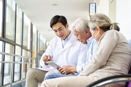 Elderly couple speaking with a doctor